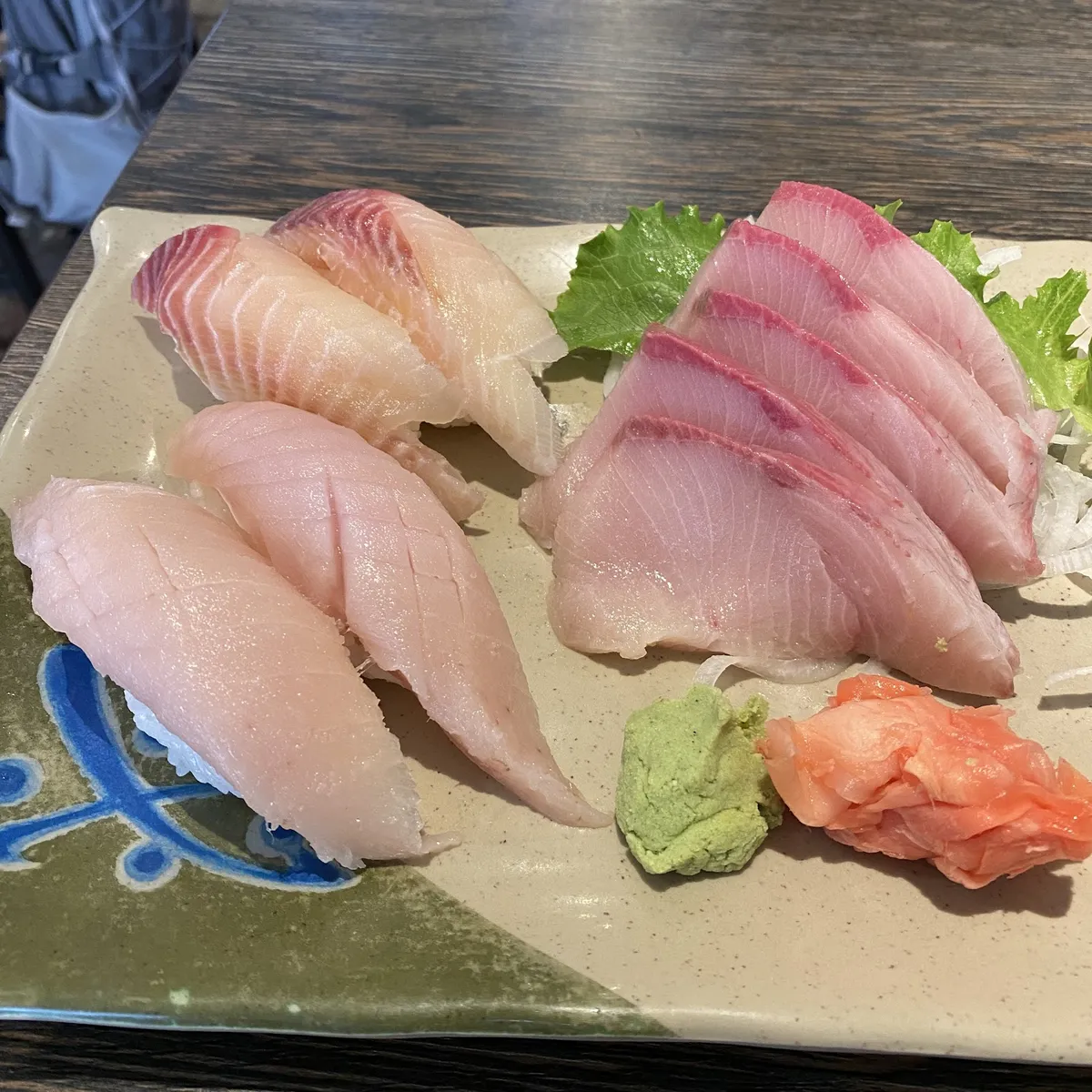 Plate of sushi and sashimi with various toppings